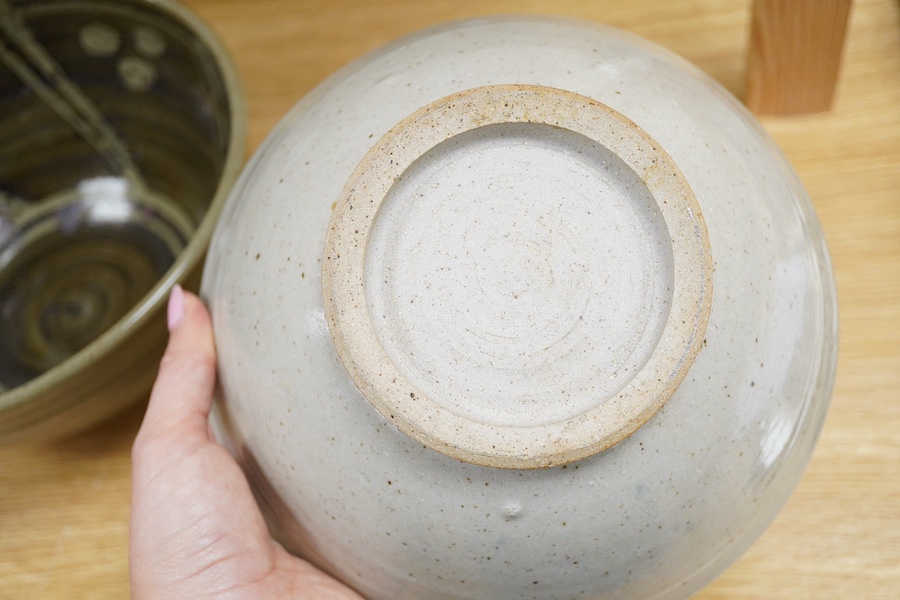 Three studio pottery bowls, one signed ‘A’ to the base, largest 34cm in diameter. Condition - good